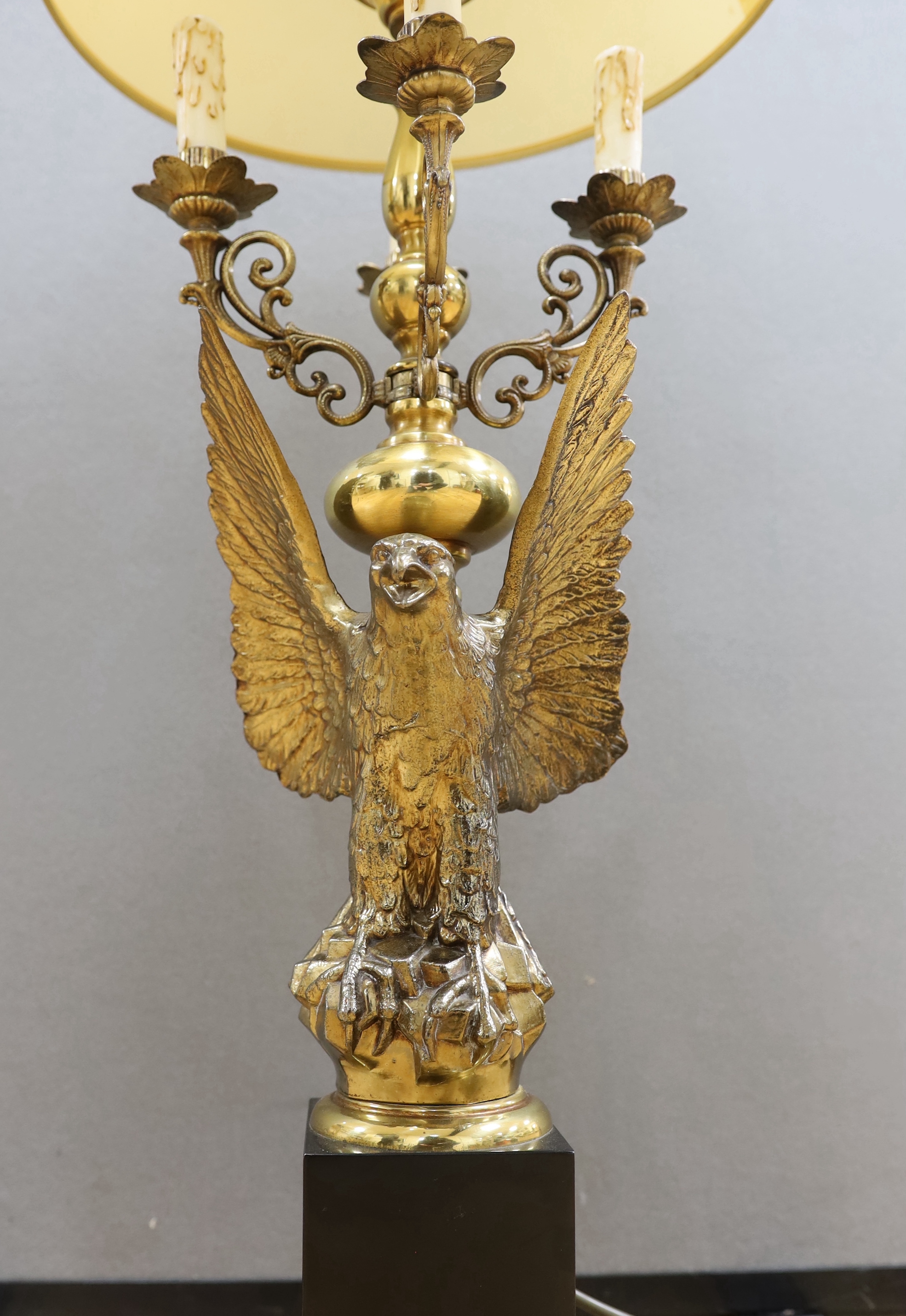 A gilt metal ‘eagle’ candelabrum, with shade, 93cm total